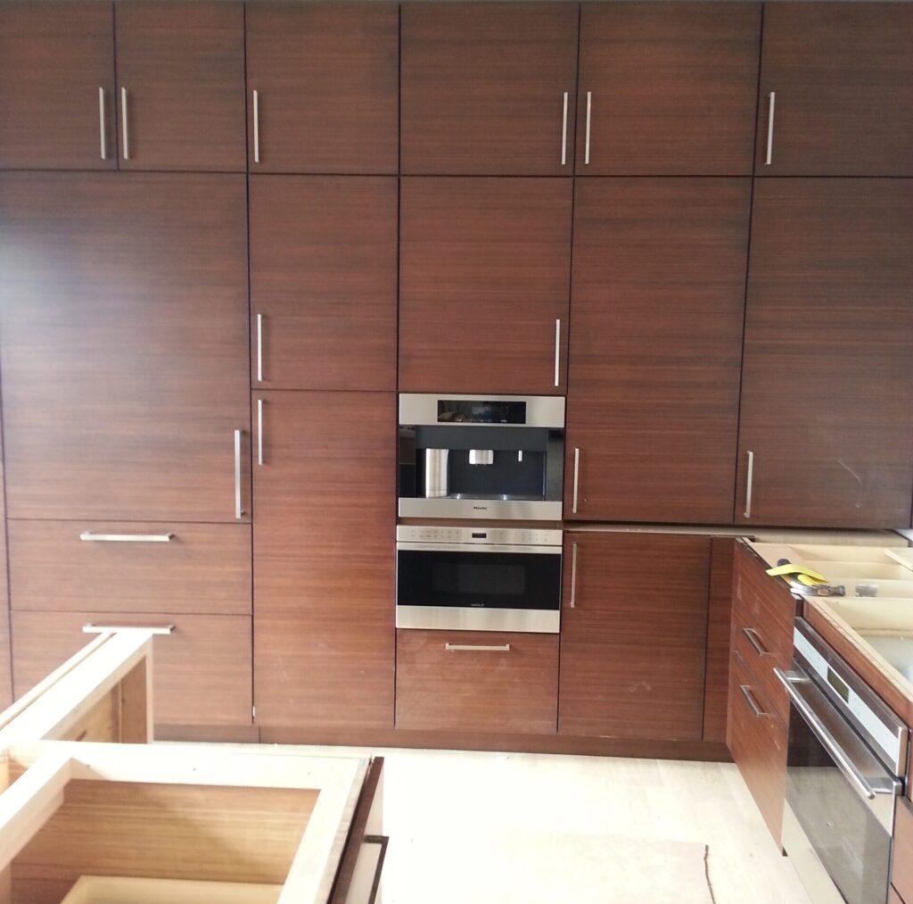 coffee-maker-and-microwave-oven between-hardwood-kitchen-drawers